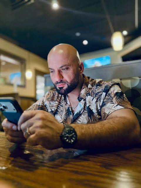 Checking messages at a restaurant