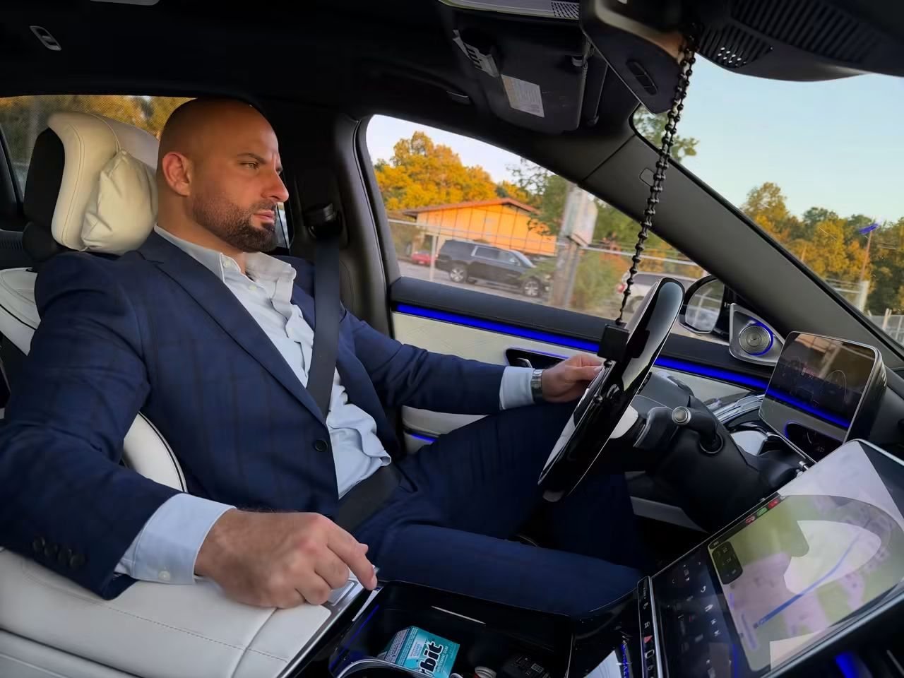 Behind the wheel in a suit
