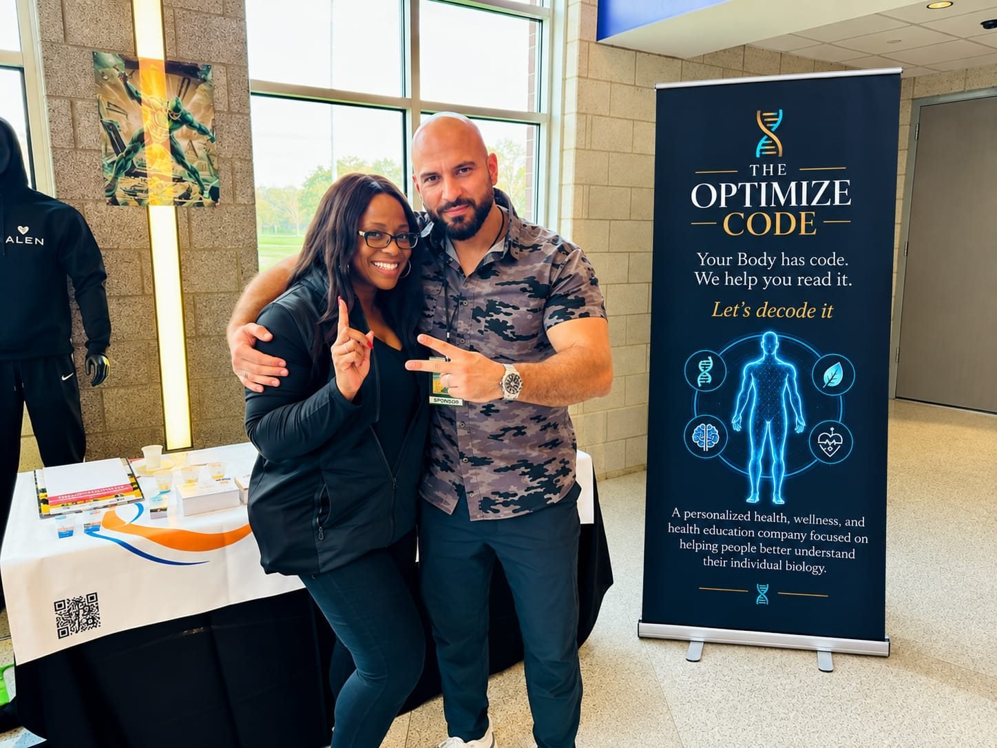 At The Optimize Code booth with an attendee